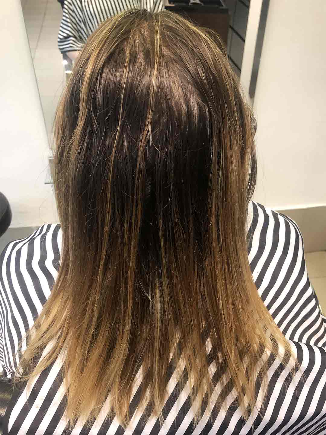 brunette root with orange blonde tips, back of the head shot